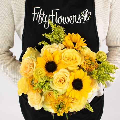 Zanzibar Yellow Flower Centerpiece in Hand